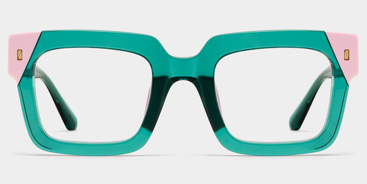Teal eyeglasses with pink temples on a light gray background