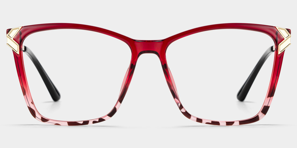 Red and gold eyeglass frames on a light gray background